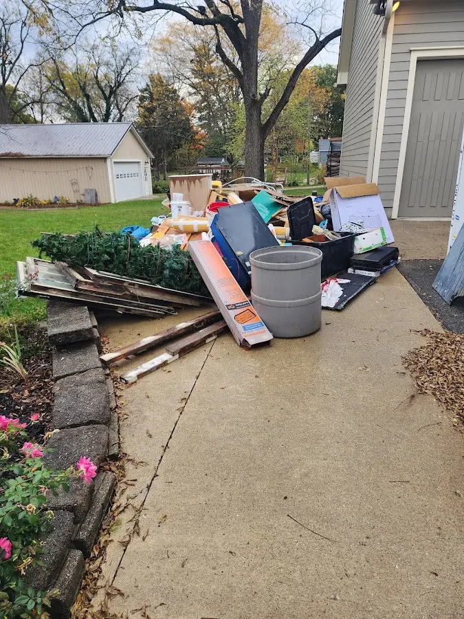 Dumpster being loaded with debris for 3 Yard Dumpster Rental in Soldotna
